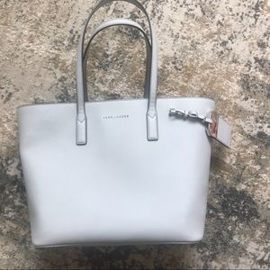 Polished and stylish, this tote bag is a chic acc